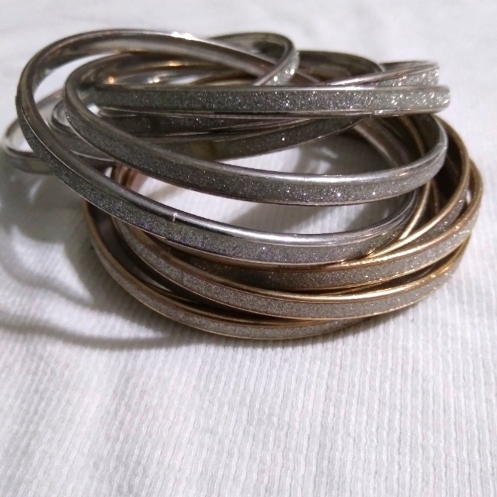 Two sets of glittery intertwined bangles